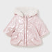 Pink side of the reversible coat. 