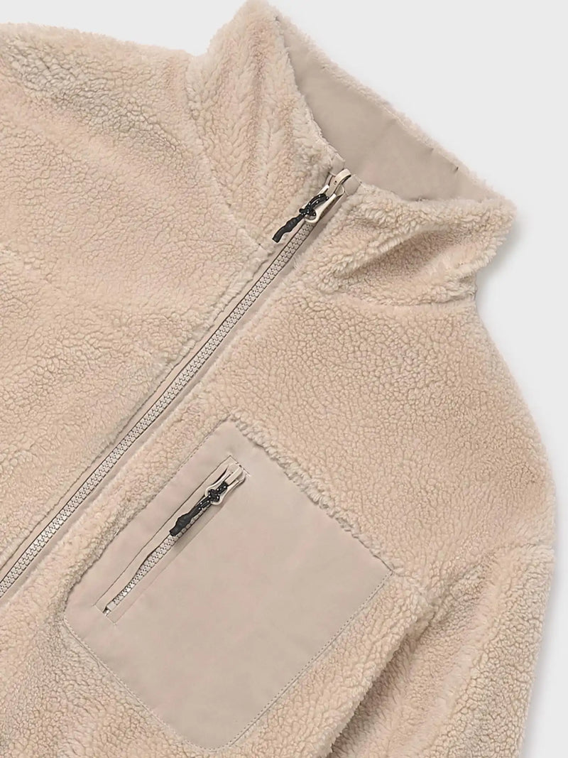 Sherpa fleece side of the girl's reversible jacket.