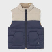 Navy and beige side of the Mayoral reversible gilet.