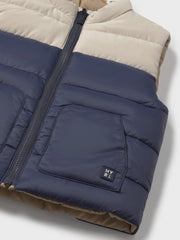 Closer look at the Mayoral reversible gilet.