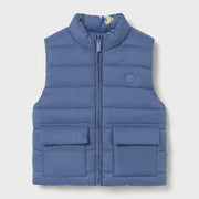 Blue side of the baby boy's reversible gilet.