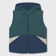 Navy and green colourblock side of the Mayoral reversible gilet.
