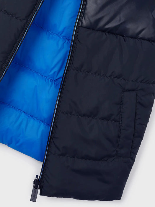 Closer look at the Mayoral reversible gilet.