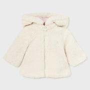 Cream side with soft faux fur lining.