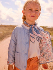 Girl modelling the Mayoral reversible jacket.