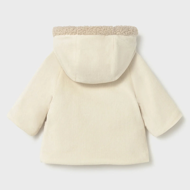 Rear view of the Mayoral reversible shearling coat.