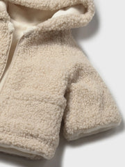 Closer view of the Mayoral reversible shearling coat.