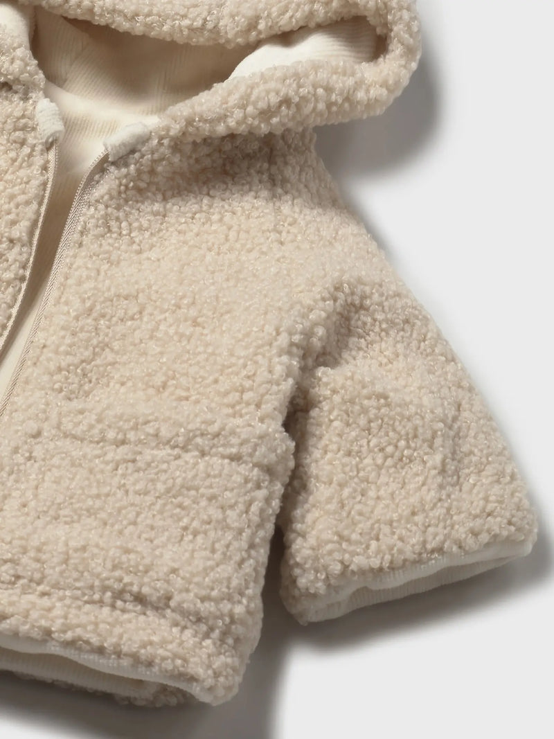 Closer view of the Mayoral reversible shearling coat.