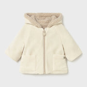 Closer look at the Mayoral reversible coat showing detail of the cream corduroy side