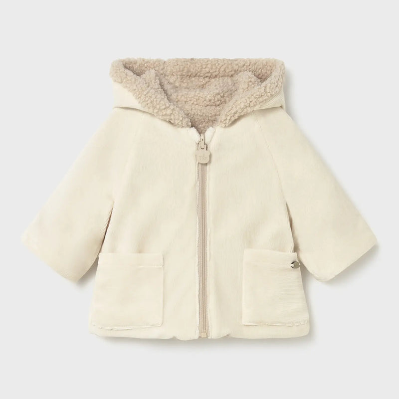 Closer look at the Mayoral reversible coat showing detail of the cream corduroy side