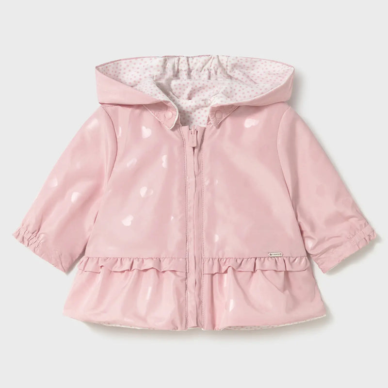 Pink side with shiny heart pattern.