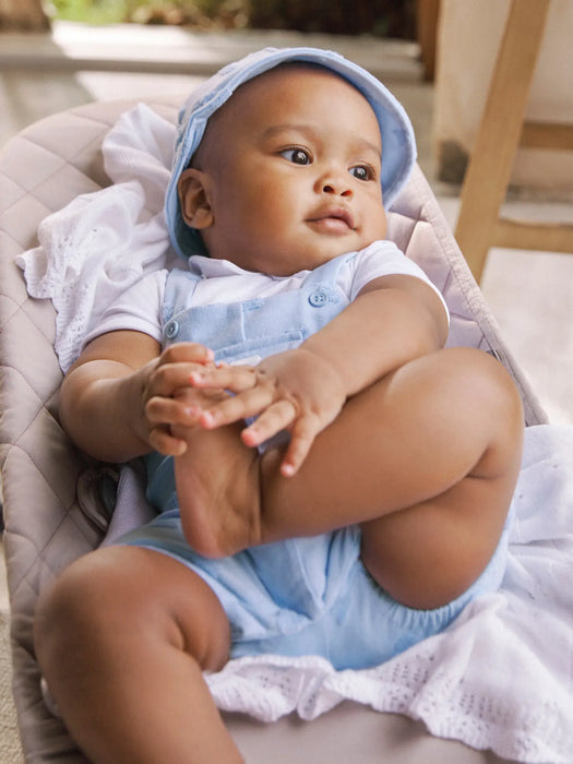 Boy wearing the Mayoral romper & hat.