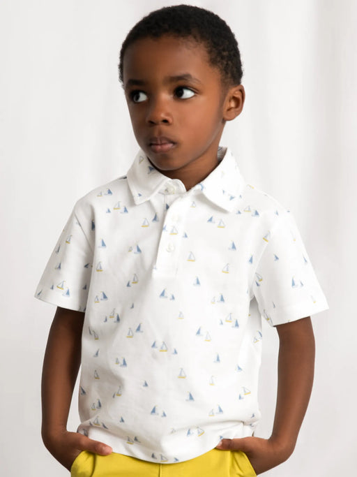Boy wearing the Mayoral sailboat polo shirt.