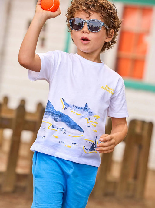 Boy modelling the Mayoral shark shorts set.