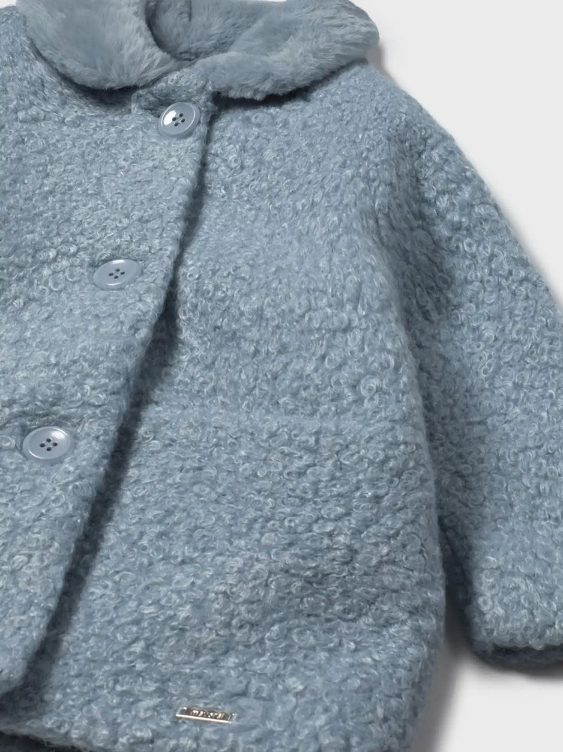 Closer view of the Mayoral shearling coat.