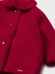 Closer view of the Mayoral shearling coat.