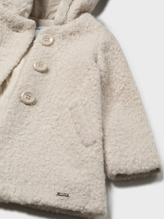 Closer look at the Mayoral shearling coat.