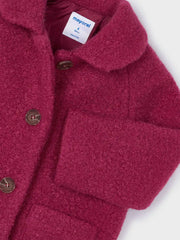 Closer view of the Mayoral shearling coat.