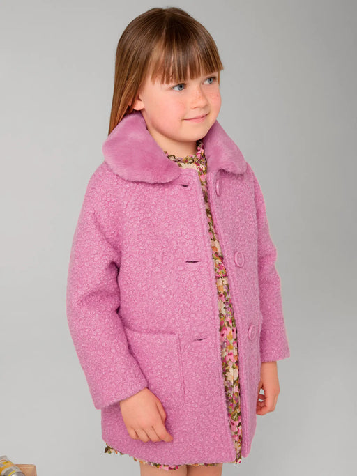 Girl modelling the Mayoral shearling coat.