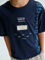 Boy wearing the Mayoral t-shirt.