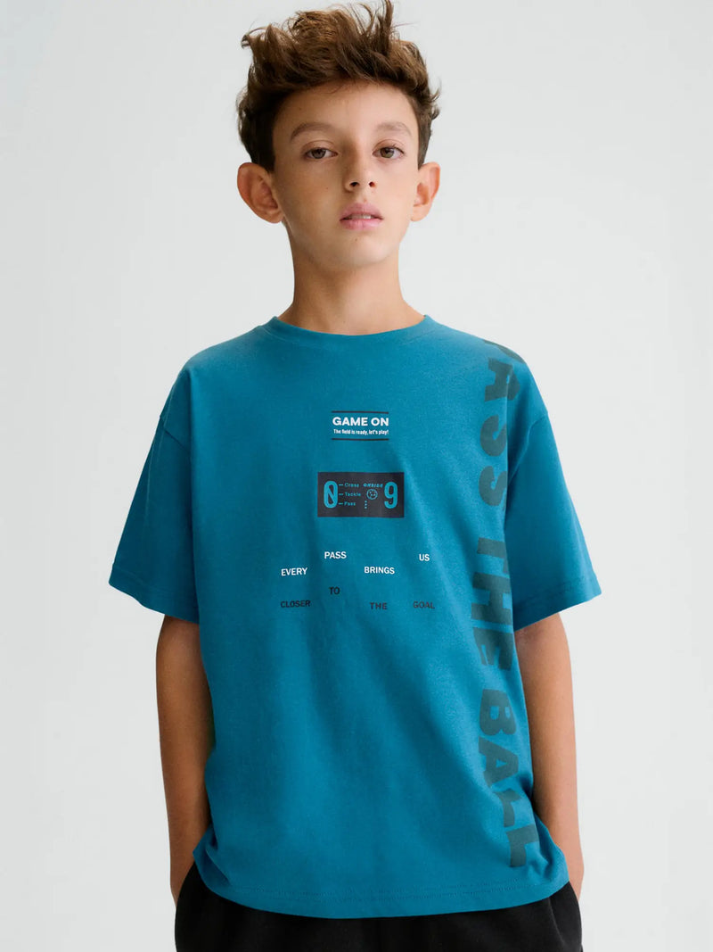 Boy wearing the Mayoral t-shirt.