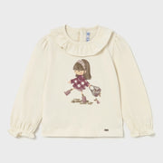 Baby girl's long sleeve cream top.