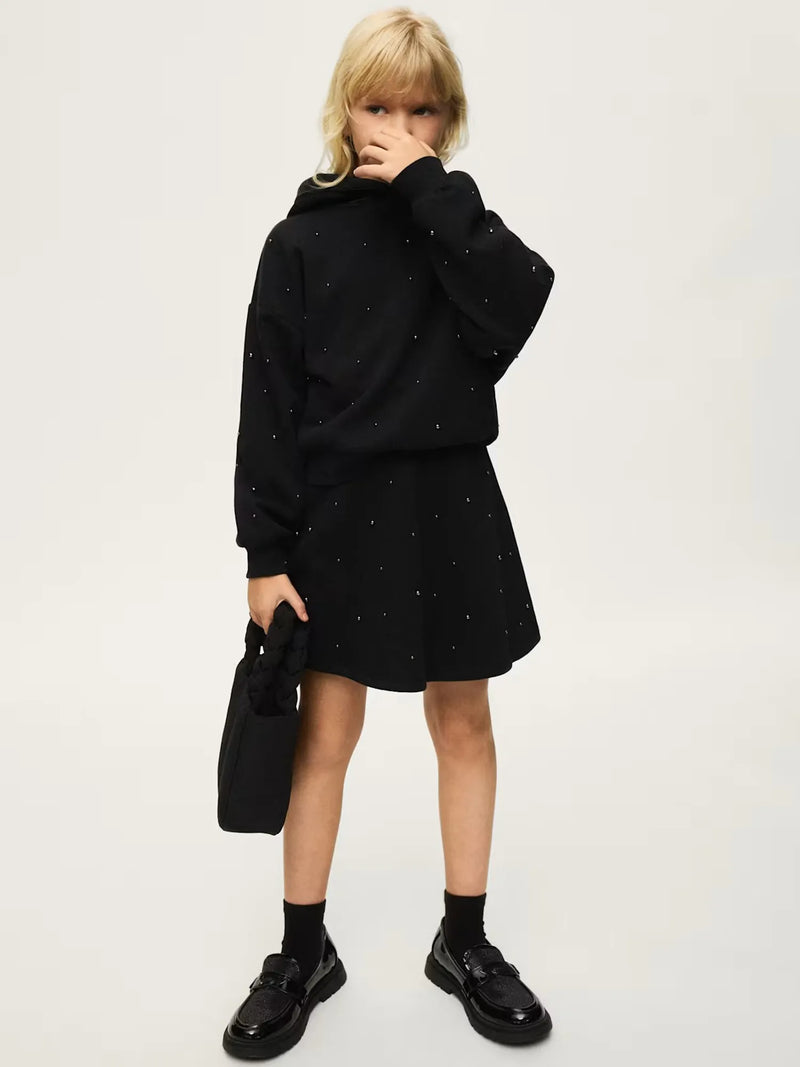 Girl modelling the Mayoral skirt set.