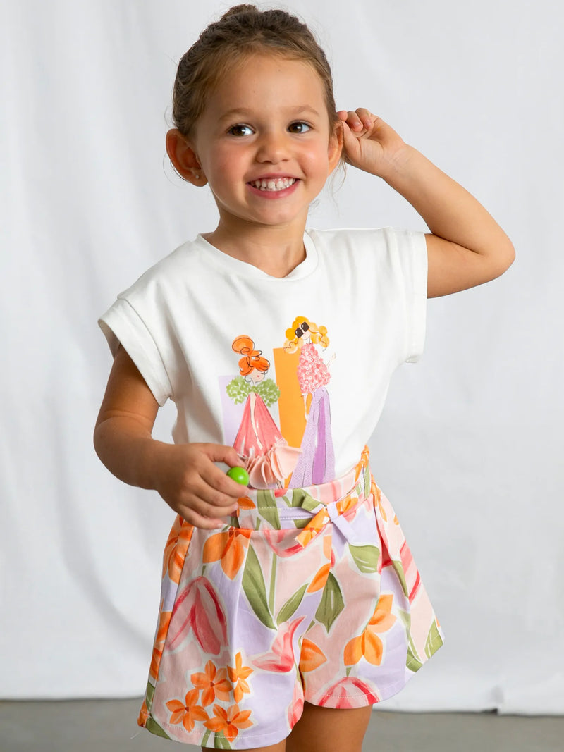 Girl modelling the Mayoral floral print shorts set.