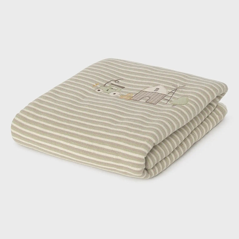 Closer look at the Mayoral striped blanket showing detail of the embroidered farm yard design.