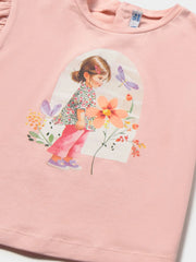 Closer view of the peach pink t-shirt.