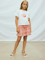 Girl modelling the Mayoral printed skirt set.