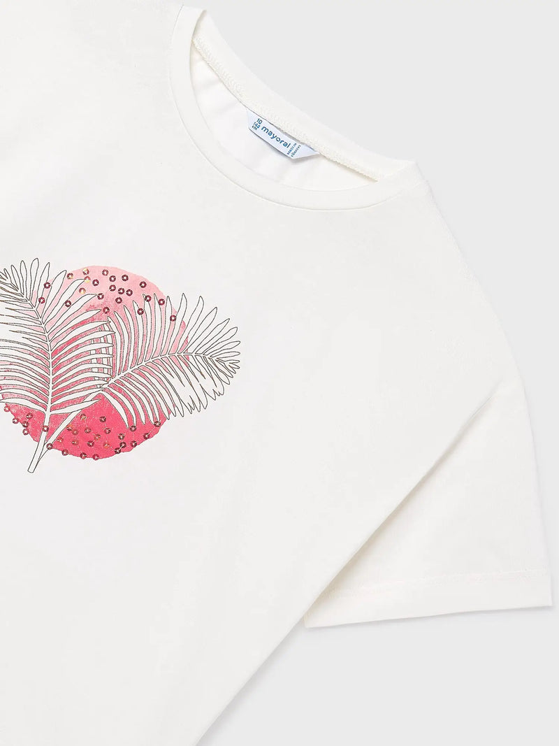 Girl's white t-shirt with palm leaf print.