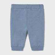 Baby boy's blue track bottoms.