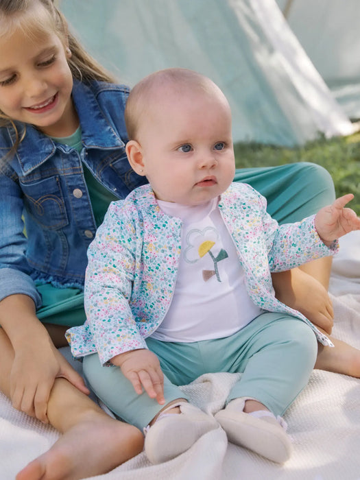 Baby girl wearing the Mayoral tracksuit.