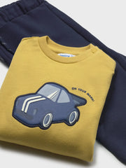 Closer look at the Mayoral tracksuit showing detail of the race car appliqué.