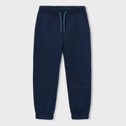Boy's navy blue track bottoms.