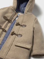 Closer look at the Mayoral duffle coat showing detail of the toggle fasteners