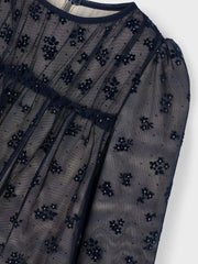 Closer look at the Mayoral tulle dress showing detail of the embroidered floral pattern