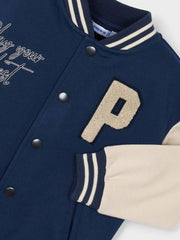 Closer look at the Mayoral varsity jacket showing detail of the