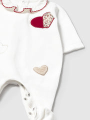 Closer view of the Mayoral velour babygrow.