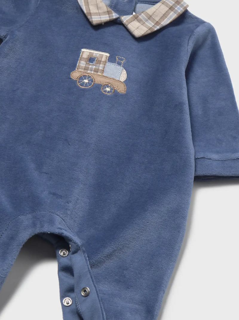 Closer look at the Mayoral velour babygrow showing detail of the adorable train appliqué.