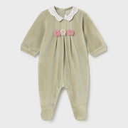 Mayoral green velour babygrow with crocheted flowers on the chest.