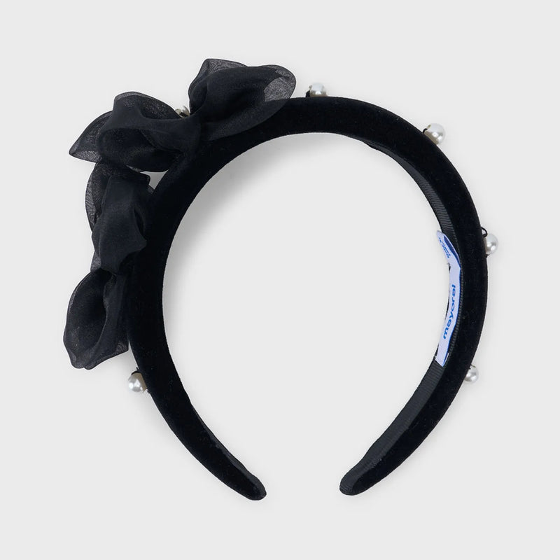 Closer view of the Mayoral velvet headband.