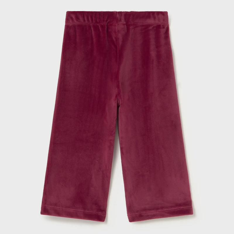 Raspberry pink velour trousers.