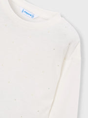 Long sleeve t-shirt dotted with sparkling rhinestones.