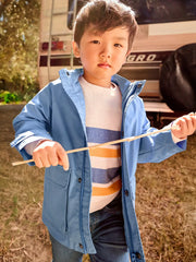 Boy modelling the Mayoral windbreaker.