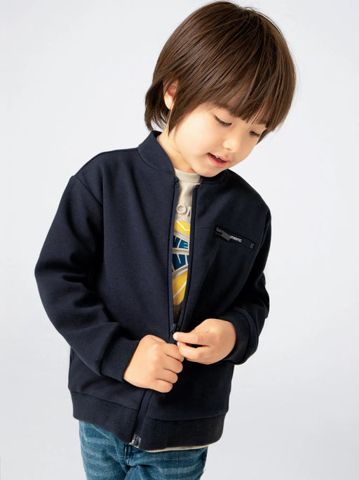 Boy modelling the Mayoral zip up sweatshirt.