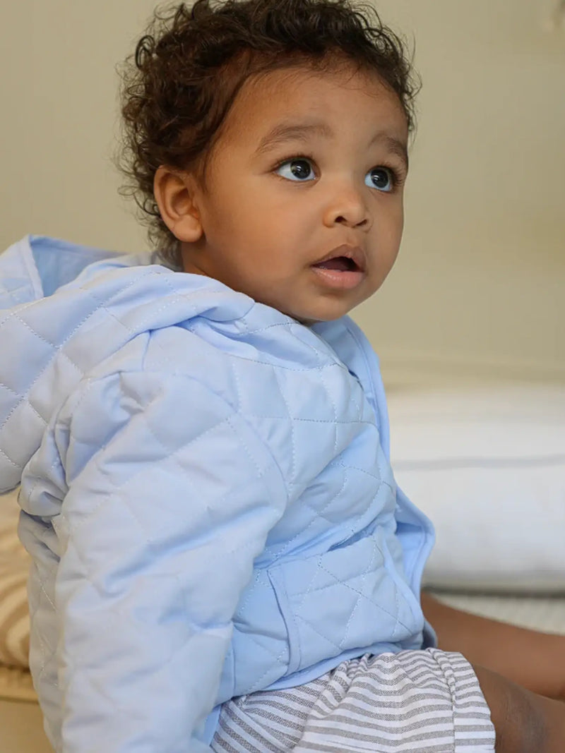Boy wearing the Mintini Baby jacket.