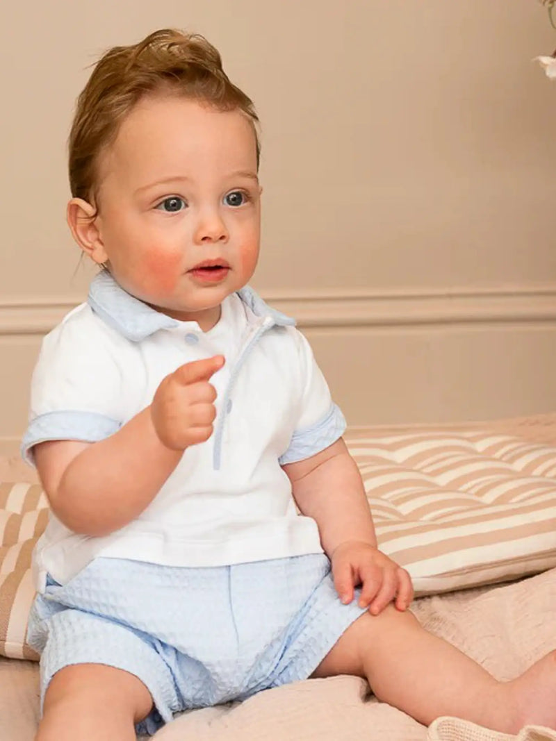 Boy wearing the Mintini Baby waffle knit romper.