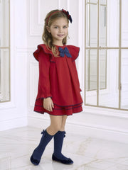 Smiling Girl modelling the Miranda bow dress.